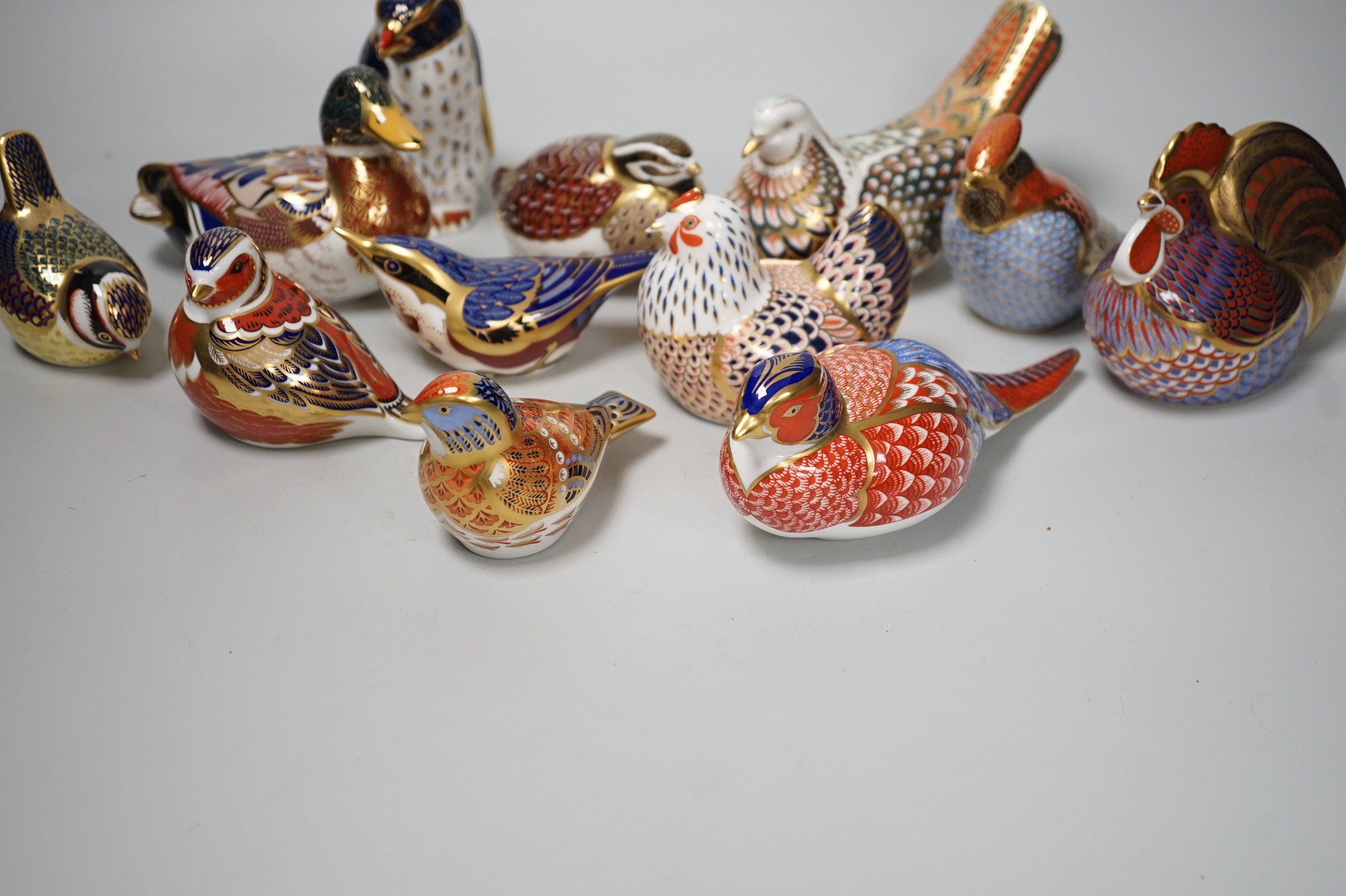 Twelve Royal Crown Derby ‘bird’ paperweights